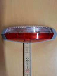 Luce di ingombro Hella ovale sinistra – 12 V con base grigia