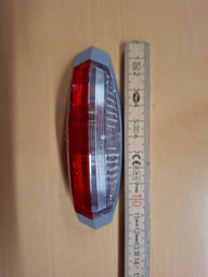 Luce di ingombro Hella ovale sinistra – 12 V con base grigia